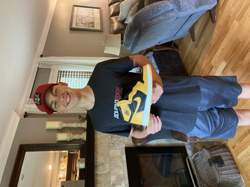 Holding the first pair of sneakers I resold