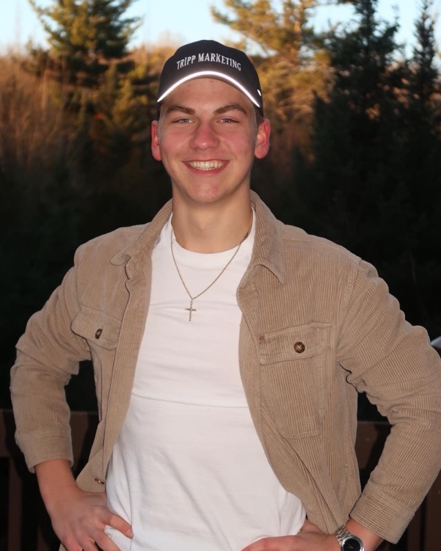 Wearing a Tripp Marketing hat