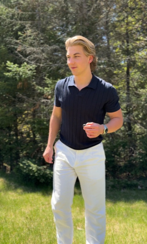 Walking outside in a navy polo